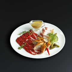 Dishes of traditional Russian cuisine. Restaurant serving. Black background.
