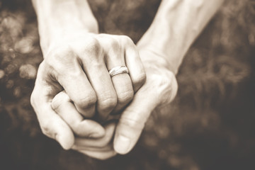 Fototapeta premium hands with wedding ring