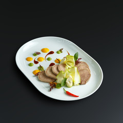 Dishes of traditional Russian cuisine. Restaurant serving. Black background.