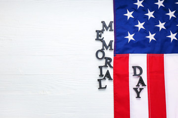 USA flag and text MEMORIAL DAY on white wooden background