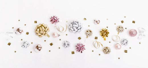 Christmas holiday composition. Festive creative gold silver pattern with ribbon on white background.