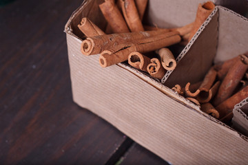 Close-up of homemade box with decorative details for decorating bouquets and wreaths, selective focus