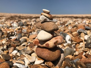 Small stones on top of each other standing on balance