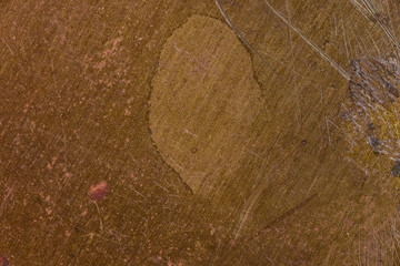 rough brass metal surface with scrathes and stains macro