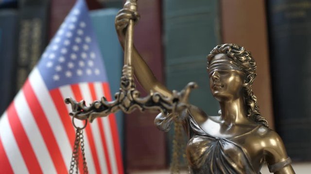 Lady justice symbol with USA Flag and Bookshelf Background. Concept of impeachment of president and democratic legal society