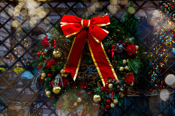 Amazing Christmas wreath with big red bow on the streets of New York, Xmas celebration concept