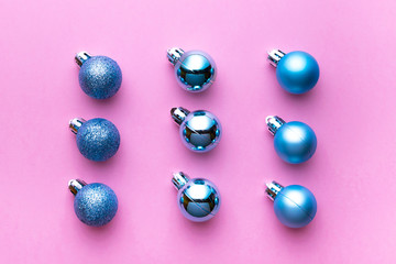 Christmas decoration balls isolated on pink background. Xmas pattern. Flat lay. Pattern winter bubble concept