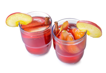 Glasses of tasty mulled wine on white background