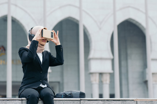 businesswoman experiencing in virtual reality glasses for controlling successful business solutions and development