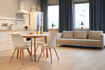 Fototapeta na wymiar Modern kitchen interior with new stylish furniture