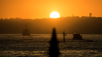 Kayaking and ferry at sunrise 