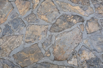 Gold texture composed of wet golden stones