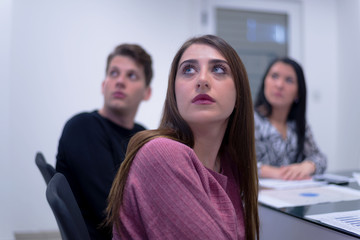 Young students listening the lecture with interest on university