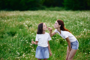 Mom and daughter in nature