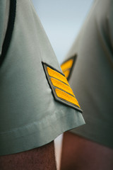Close-up of Australian Army sergeant rank insignia during ANZAC Day remembrance ceremony