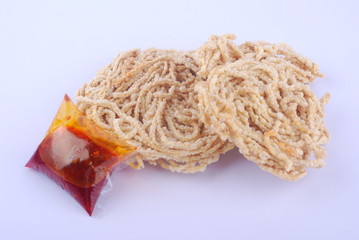 Mee siput is a famous local snack eaten with sambal or chili sauce.