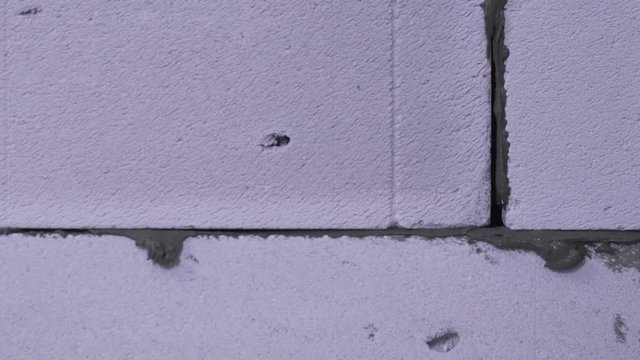 laying brick on concrete close-up