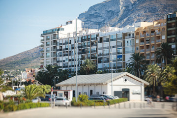 Fototapeta na wymiar Beautiful street view of Denia, Marina Alta with harbor and skyline, Montgo mountain, beach and city, province of Alicante, Valencia, Spain
