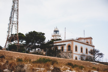 Beautiful super wide-angle aerial view of Xabia, Javea, Marina Alta with harbor and skyline, mountains, beach and city, seen from Cabo de San Antonio viewpoint, province of Alicante, Valencia, Spain