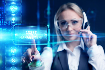 Business, Technology, Internet and network concept. Marketing content. Businessman presses a button Asset management on the virtual screen tablet future.