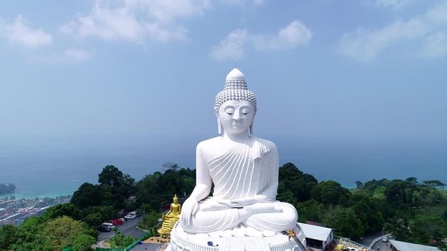 Aerial View drone shot of Big Buddha Statue on the high mountain at Phuket thailand	