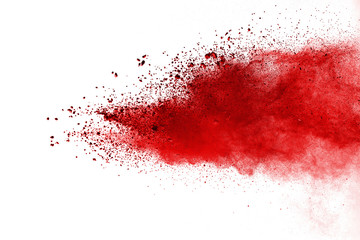 Red powder explosion on white background. Colored cloud. Colorful dust explode. Paint Holi.