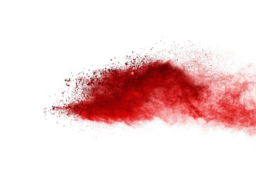 Red powder explosion on white background. Colored cloud. Colorful dust explode. Paint Holi.