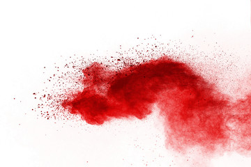 Red powder explosion on white background. Colored cloud. Colorful dust explode. Paint Holi.