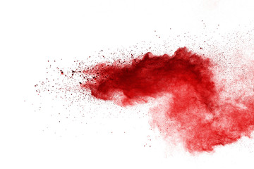 Red powder explosion on white background. Colored cloud. Colorful dust explode. Paint Holi.