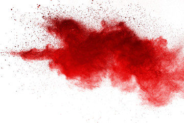 Red powder explosion on white background. Colored cloud. Colorful dust explode. Paint Holi.