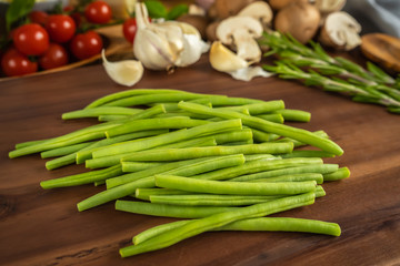 Green beans on a wooden board