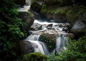 Landscape of a waterfall in an Indian forest during the peak monsoon season