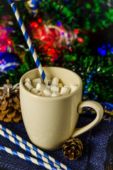 Obraz na płótnie Canvas cup of drink with marshmallows on christmas background