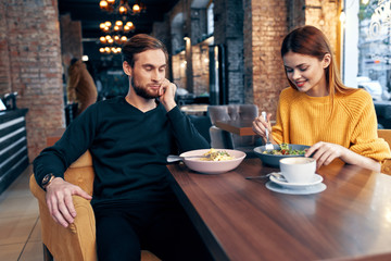 young couple having dinner in restaurant