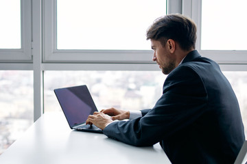 man working on laptop at home