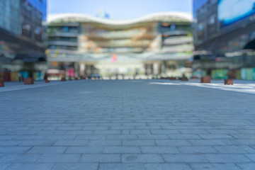 Obraz premium modern buildings and empty pavement in china.