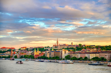 Fototapeta premium The Buda side of Budapest, Hungary along the Danube River at sunset.