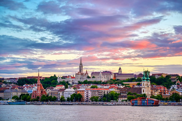 Fototapeta premium The Buda side of Budapest, Hungary along the Danube River at sunset.