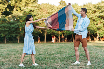 family playing with ball in the park