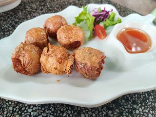 Deep fried crab meat rool on white plate.Chinese food.
