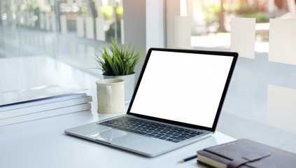 Fototapeta premium Workspace desk and laptop. copy space and blank screen. Business image, Blank screen laptop and supplies.