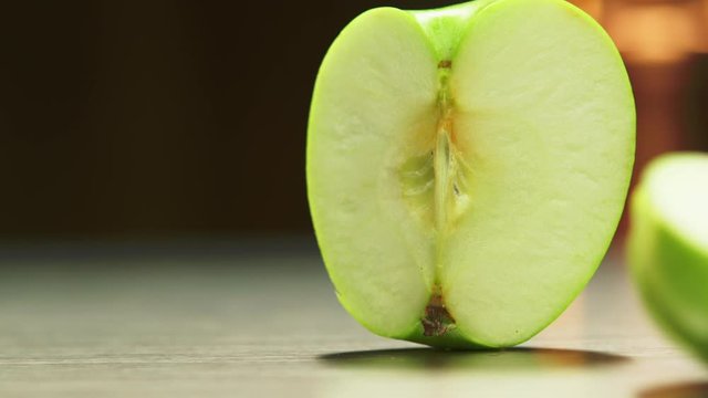 Green apple sliced in three