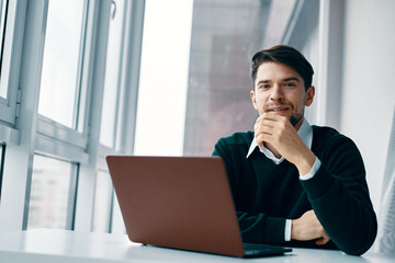 businesswoman working on laptop in office