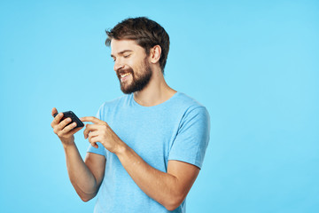 portrait of young man with mobile phone