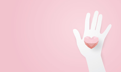 Paper art of hand with red polygonal heart, Volunteer