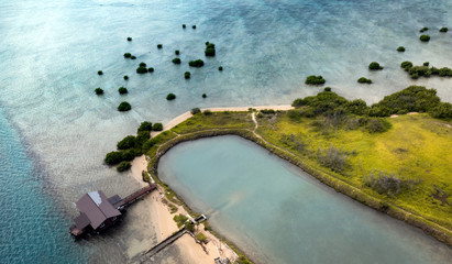 Beautiful nature of Hawaii paradise: mountains, ocean and clods shot from helicopter (aerial pic) at summer sunset time