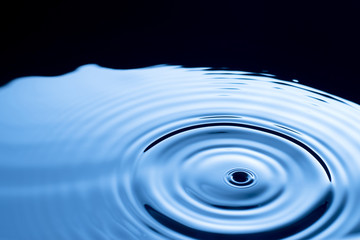 A close up of clean blue water droplets.