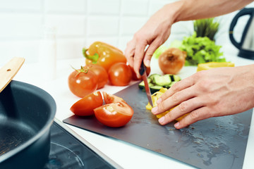 woman cutting vegetables in the kitchen