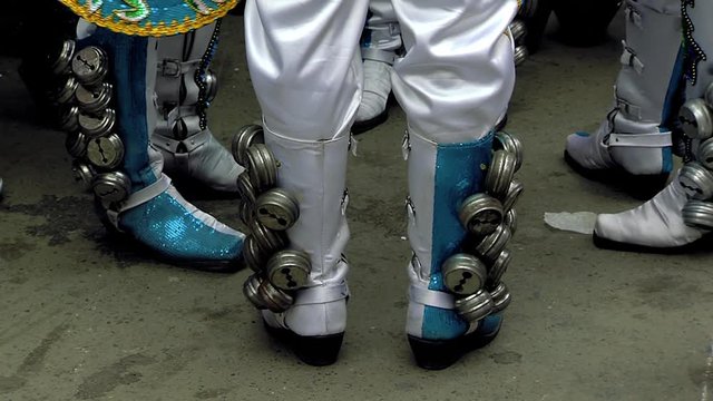 Legs of Caporales Dancers in Ornate Costume at city of Oruro on the Altiplano of Bolivia during the Annual Carnival.