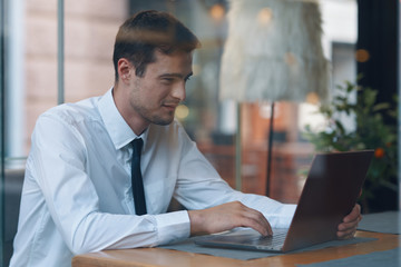 Fototapeta na wymiar businessman working on tablet computer in office